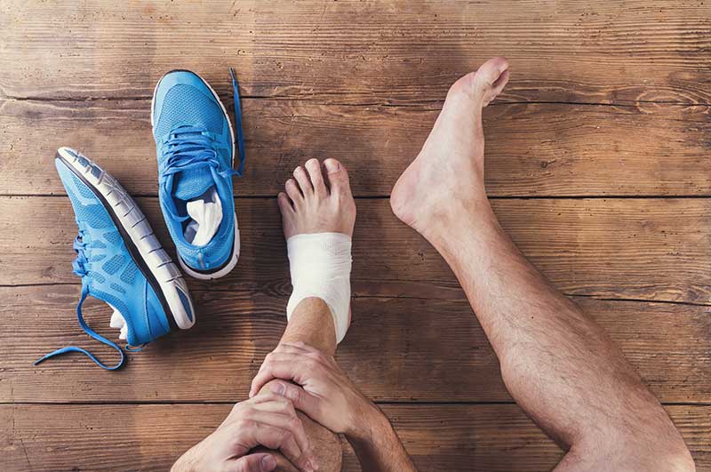 runner-taped-ankle - Arizona Foot and Ankle Physicians foot exam appointment